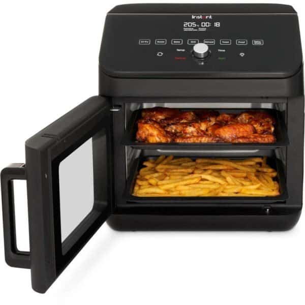 Modern air fryer oven with digital control panel, cooking chicken wings and French fries, versatile kitchen appliance for healthy frying, baking, roasting, and grilling.